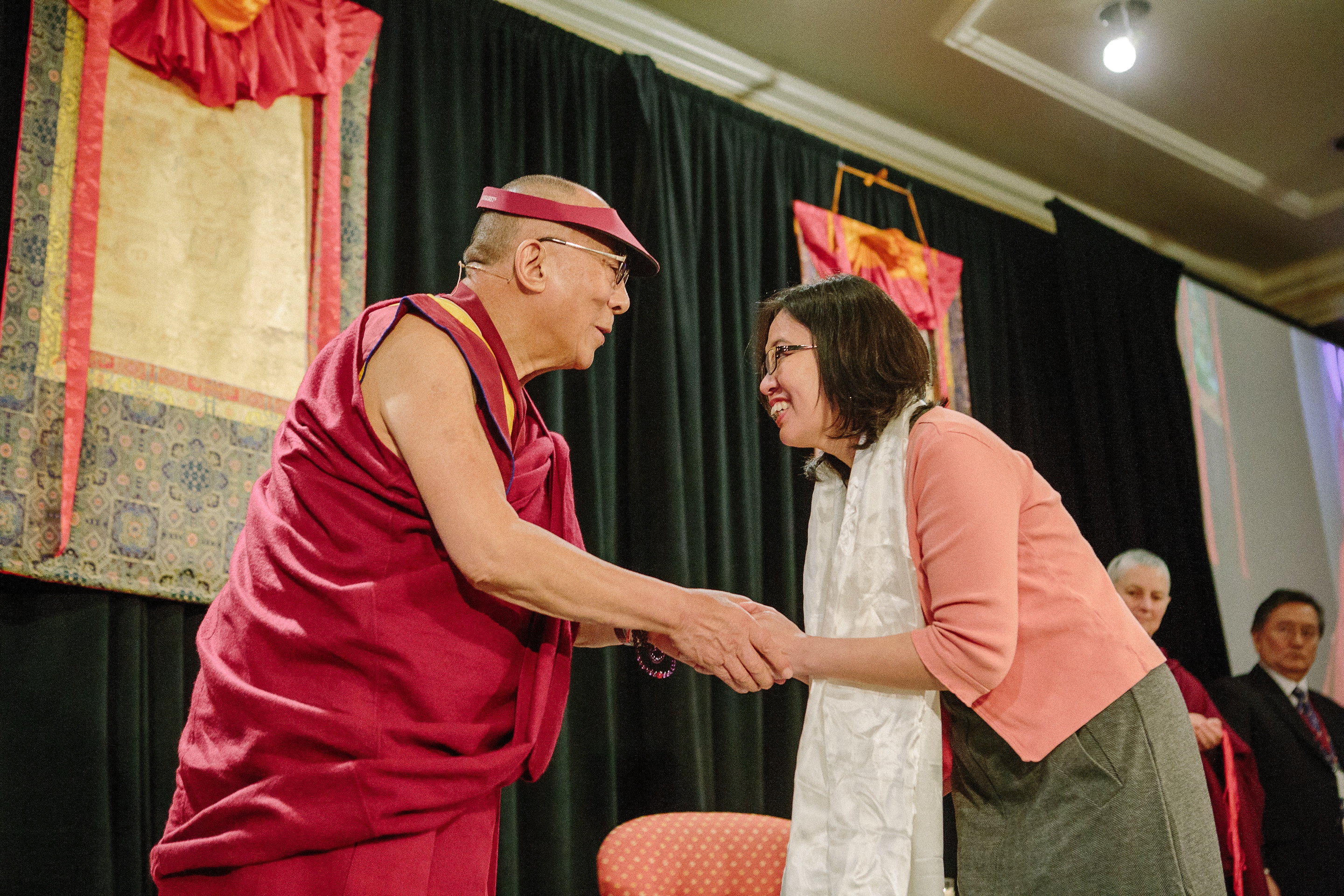 PHOTO: Wendy Wong (right), founder of Education at Elevation (E@E) is acknowledged by His Holiness, the Dalai Lama (left), at the recent “Unsung Heroes of Compassion” event. PHOTO CREDIT:BRIANA FORGIE.